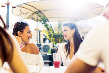 Two young girls talking during lunch break