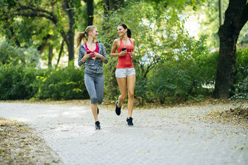 Energetic young women running outdoors