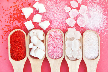 Fototapeta Mix of sugar varieties: pink, red and white, refined, granulated and cubes, selective focus obraz