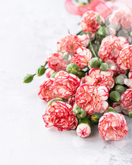 Beautiful greeting card concept with pink carnation flowers bouquet for valentine or mother day. Copy space and bokeh.