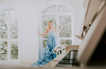 Beautiful woman with fancy wedding dress make preparations for the event