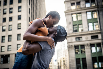 Young afro american kissing in New york