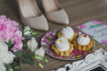 Three cakes on the table near the flowers 9633.