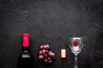 Drink red wine. Bottle and glass on whiye background top view copyspace