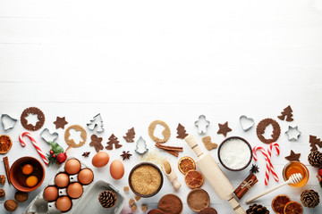 Baking christmas cookies on white wooden table