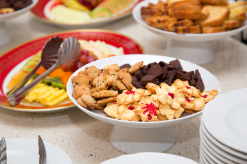 Served holiday table - cookies, sweets, fruit.