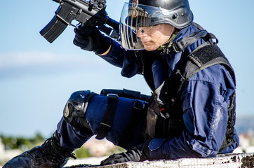 Obraz premium Police special forces, blue uniform and protection helmet