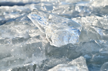 Glare of light reflected in the shards of pure ice.