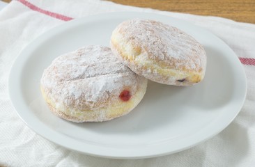 Plate of Fresh Donut Filled with Strawberry Jam
