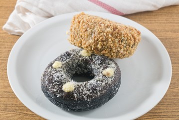 Dish of Fresh Chocolate Donut and Peanuts Donut