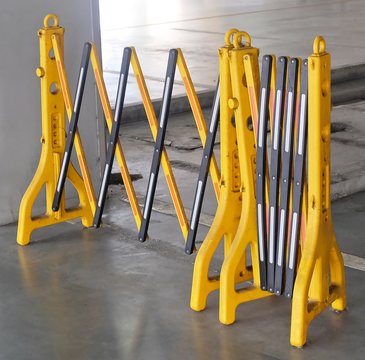 Yellow Portable Plastic Barriers Blocking The Road
