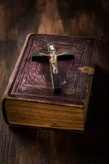 Holy bible with wooden cross