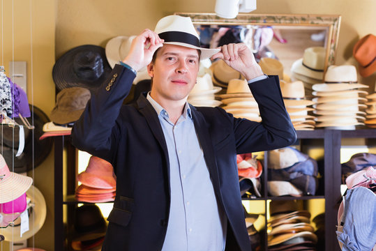 Portrait Of  Guy Try On Sun Hat At Headwear Store