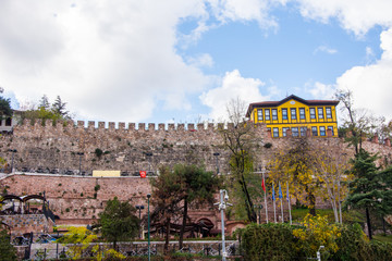 wall of castle and yellow house in Bursa