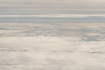 Fototapeta na wymiar flying above the clouds in daytime