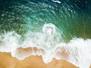Top view of a deserted beach. The Portuguese coast of the Atlantic Ocean.