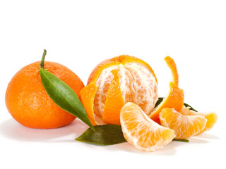 Ripe mandarin with leaves close-up