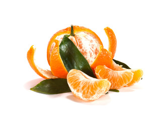 Ripe mandarin with leaves close-up