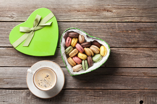 Macaroons in Valentines day gift box and coffee