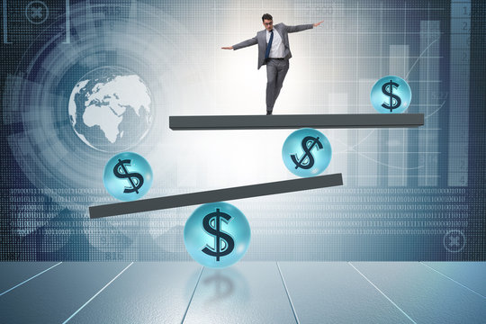 Businessman balancing in financial dollar concept