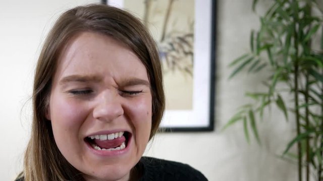 Brunette woman makes hilarious ridiculous goofy face ALT