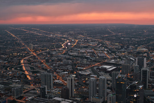 Chicago skyline, cityscape from above at Skydeck Willis Tower during sunset dusk