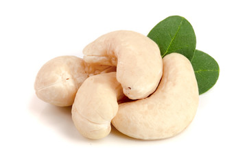 cashew nuts with leaf isolated on white background. macro