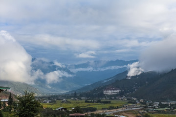 View of Rinpung Dzong on a dramatically cloudy day in Paro valley, Bhutan