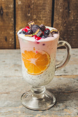cocktail with berries and chia seeds (pink and white layers)