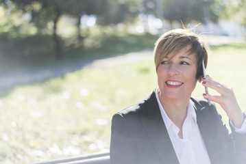 businesswoman having a conversation using a smartphone on a phon