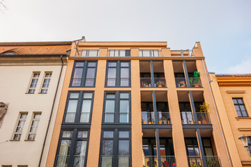 orange apartment building with steel balcony