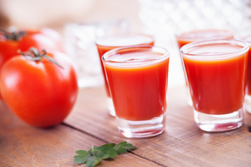 Cold Bloody Mary cocktail shot in glasses 