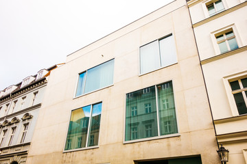 Fototapeta na wymiar warm colored modern concrete building with panoramic windows