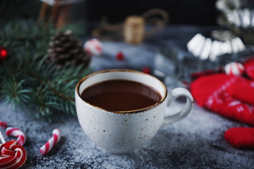 Cup of hot chocolate or cocoa and variety of christmas sweet candies