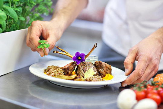 Busy Chef At Work In The Restaurant Kitchen