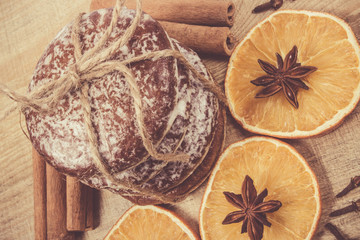 Gingerbread cookies, cinnamon and orange slices. Christmas decoration.