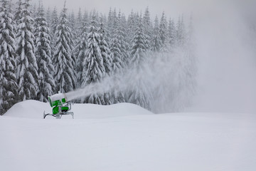 Snow making machine. Snow cannon in mountain