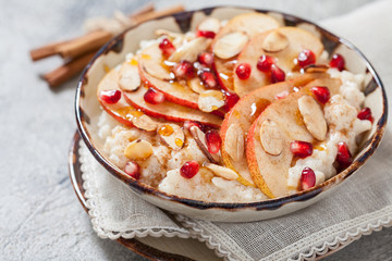 Coconut rice with pomegranate, pear and almond slices