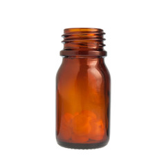 Medical bottle with pills isolated on white background