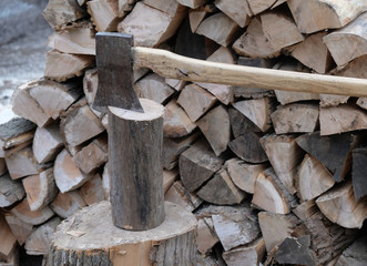 Wood ax in a block of firewood
