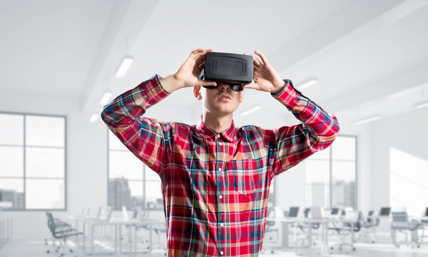 Concept of modern entertaining technologies with man wearing virtual reality mask