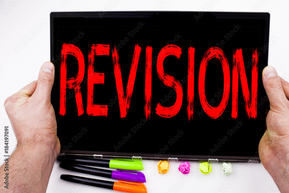 Fototapete revision text written on tablet, computer in the office with marker, pen, stationery. business conce