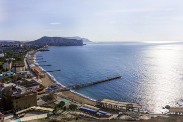 Fototapeta na wymiar top view of the sea and coastal town on a Sunny day