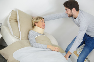 male assistance consoling an injured female patient © auremar