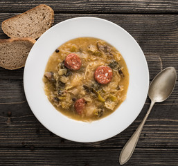 Slovak christmas cabbage soup with mushrooms on natural background.