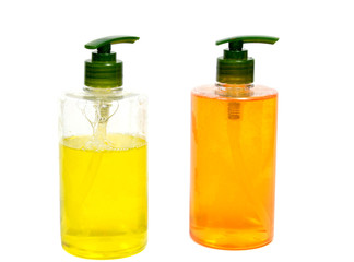 Liquid soap bottle yellow fluid in a bottle isolated on a white background.