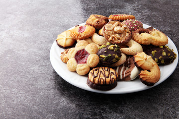 Fototapeta premium Plate with tasty fresh Christmas cookies on table