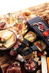 Delicious traditional Swiss melted raclette cheese on diced boiled or baked potato served in individual skillets.