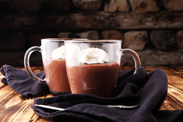 Hot chocolate or coffee with whipped cream in glass.