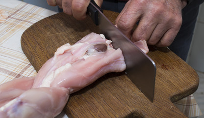 cutting rabbit meat for cooking, butchering